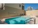 Inviting community pool with lounge chairs and well maintained decking at 235 Cocoanut Ave # 108B, Sarasota, FL 34236