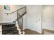 Staircase with black railing and carpet, featuring white trim and multiple white doors at 235 Cocoanut Ave # 108B, Sarasota, FL 34236