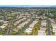 This aerial view showcases a community with easy access to the water and picturesque landscaping at 2749 Riverbluff Pl # V65, Sarasota, FL 34231