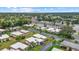 A birds-eye view of a lovely neighborhood, displaying homes with manicured lawns and convenient parking spaces at 2749 Riverbluff Pl # V65, Sarasota, FL 34231