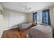 Cozy bedroom with wood floors, ceiling fan and large sliding door closet at 2749 Riverbluff Pl # V65, Sarasota, FL 34231