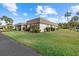 Charming single-story home with mature landscaping, green lawn and a 1-car carport at 2749 Riverbluff Pl # V65, Sarasota, FL 34231