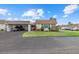 Charming single-story home with carport and manicured front lawn in a quiet neighborhood at 2749 Riverbluff Pl # V65, Sarasota, FL 34231