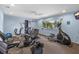 Well-equipped fitness center featuring modern exercise machines and a bright, inviting atmosphere, and a beautiful view at 2749 Riverbluff Pl # V65, Sarasota, FL 34231