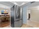 Kitchen with stainless steel refrigerator and view of dining room at 2749 Riverbluff Pl # V65, Sarasota, FL 34231