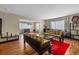 Bright living room showcasing hardwood floors, stylish seating, and lots of natural light at 2749 Riverbluff Pl # V65, Sarasota, FL 34231