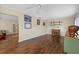 Living room featuring wood floors, a ceiling fan, and ample natural light at 2749 Riverbluff Pl # V65, Sarasota, FL 34231