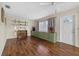 Living room featuring wood floors, a ceiling fan, and ample natural light at 2749 Riverbluff Pl # V65, Sarasota, FL 34231