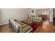 Open-concept living room with hardwood floors, lots of light and adjacent to the dining area at 2749 Riverbluff Pl # V65, Sarasota, FL 34231