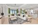 Open concept living room connected to the kitchen, featuring stylish furniture and decor at 3607 Santa Caterina Blvd, Bradenton, FL 34211