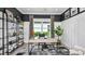 Comfortable home office with modern decor, ample natural light, and stylish shelving at 3607 Santa Caterina Blvd, Bradenton, FL 34211