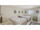 Bedroom features two twin beds, tile flooring, and closet at 3705 S School Ave # 3, Sarasota, FL 34239
