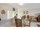 Bright dining room features a glass table, seating for four, and an open view to the kitchen at 3705 S School Ave # 3, Sarasota, FL 34239