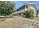 Charming two-story condo with screened balcony and lush landscaping, offering a serene outdoor space at 3705 S School Ave # 3, Sarasota, FL 34239