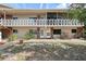 Inviting condo building featuring a balcony, well-maintained grounds, and charming curb appeal at 3705 S School Ave # 3, Sarasota, FL 34239