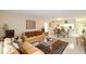 Bright living room with tile floors, comfortable seating, and dining area, perfect for entertaining at 3705 S School Ave # 3, Sarasota, FL 34239