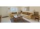 Cozy living room featuring comfortable seating, a bright window, and tile flooring at 3705 S School Ave # 3, Sarasota, FL 34239
