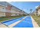 Exterior view of shuffleboard courts at this lovely complex with tropical palms at 3705 S School Ave # 3, Sarasota, FL 34239