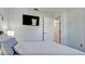 Comfortable bedroom featuring a wall mounted television at 3911 39Th W Ave, Bradenton, FL 34205