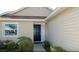 Welcoming front entrance with a classic dark door, complemented by the manicured landscaping at 3911 39Th W Ave, Bradenton, FL 34205