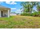 Expansive backyard with lush landscaping and ample room for recreation at 3924 Candia Ave, North Port, FL 34286