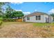 Large, grassy backyard showcasing the property's outdoor space and privacy at 3924 Candia Ave, North Port, FL 34286