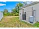 A lush backyard features storage shed, water treatment system, and ample space at 3924 Candia Ave, North Port, FL 34286