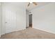 Neutral bedroom with an entry door and closet doors at 3924 Candia Ave, North Port, FL 34286