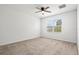 Bright bedroom with a ceiling fan and a window with a view to the yard at 3924 Candia Ave, North Port, FL 34286