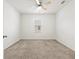 Cozy bedroom with neutral carpet, white walls, and a ceiling fan at 3924 Candia Ave, North Port, FL 34286