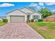 Charming single-story home with a two-car garage and well-maintained lawn at 3924 Candia Ave, North Port, FL 34286