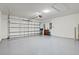 Spacious garage with an automatic door, overhead lighting, and ample space at 3924 Candia Ave, North Port, FL 34286