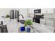 Close-up of the kitchen island, featuring marble countertops and a stylish faucet and sink at 3924 Candia Ave, North Port, FL 34286