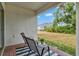 Covered outdoor patio with view of backyard space and lawn at 3924 Candia Ave, North Port, FL 34286