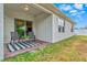 Covered patio with outdoor seating and a view of the backyard at 3924 Candia Ave, North Port, FL 34286