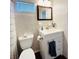 Bright bathroom features a white vanity with storage and a classic framed mirror at 415 Oakwood W Blvd, Sarasota, FL 34237