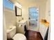 Bathroom with vanity, mirror, tiled walls, and view of the bedroom at 415 Oakwood W Blvd, Sarasota, FL 34237
