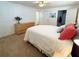 Bedroom with neutral walls, plush carpeting, and view of bathroom at 415 Oakwood W Blvd, Sarasota, FL 34237