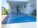 Home featuring a covered parking area and manicured landscaping, creating a welcoming atmosphere at 415 Oakwood W Blvd, Sarasota, FL 34237
