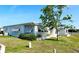 Well-maintained single-story home with tidy landscaping at 415 Oakwood Blvd, Sarasota, FL 34237