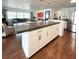 Open concept kitchen with long island, stainless steel appliances, and view of the living room at 415 Oakwood W Blvd, Sarasota, FL 34237