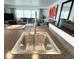 Kitchen sink with stainless steel faucet and seating space at kitchen island at 415 Oakwood W Blvd, Sarasota, FL 34237