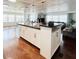 Open concept kitchen with long island, stainless steel appliances, and view of the living room at 415 Oakwood W Blvd, Sarasota, FL 34237