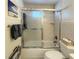 Shower over tub enclosed with sliding glass doors and chrome hardware at 415 Oakwood W Blvd, Sarasota, FL 34237