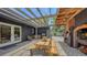 Backyard featuring a grill, pizza oven and dining area, ideal for outdoor gatherings at 4857 Stevens Dr, Sarasota, FL 34234