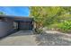 Backyard displaying the property's covered parking with lush landscaping, enhancing curb appeal at 4857 Stevens Dr, Sarasota, FL 34234