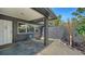 Cozy outdoor seating area, complemented by stylish decor and manicured landscaping for relaxing and welcoming curb appeal at 4857 Stevens Dr, Sarasota, FL 34234