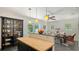 Open-concept kitchen with island seating and seamless flow to the dining area at 4857 Stevens Dr, Sarasota, FL 34234
