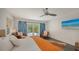 Bright and inviting main bedroom with French doors to the backyard and stylish decor at 4857 Stevens Dr, Sarasota, FL 34234