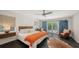 Serene main bedroom with French doors leading to the backyard and ample natural light at 4857 Stevens Dr, Sarasota, FL 34234